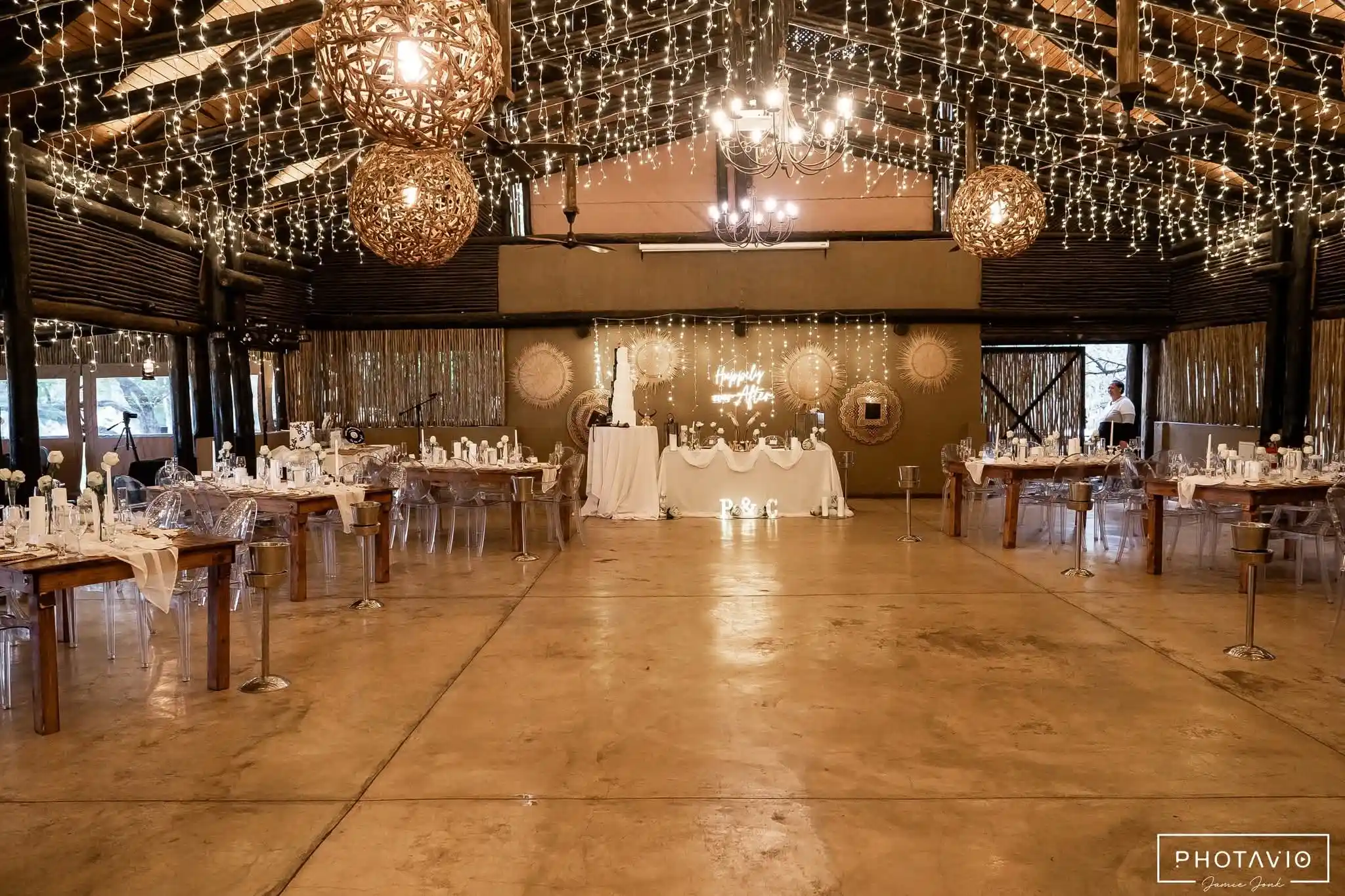 A Syzygy activation glowing in a darkened event space